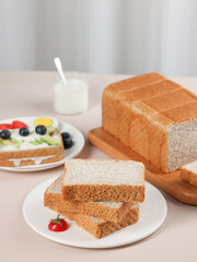 Scene with toast bread with fruit and milk, healthy breakfast, indoor kitchen photography