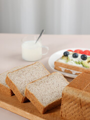 Scene with toast bread with fruit and milk, healthy breakfast, indoor kitchen photography