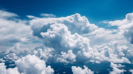 Naklejka na ściany i meble Blue sky with specific clouds. See over the clouds.summer blue sky cloud slant light white establishment. AI Generated