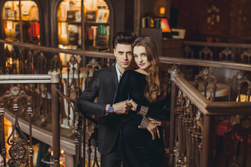 Fototapeta na wymiar Sexual passionate couple in elegant evening dresses. Luxurious interior. Fashion shot.