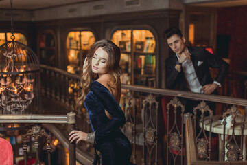 Fototapeta na wymiar Sexual passionate couple in elegant evening dresses. Luxurious interior. Fashion shot.