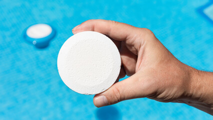 Pool cleaner with chlorine tablets to have optimal water quality for bathing in summer. White...