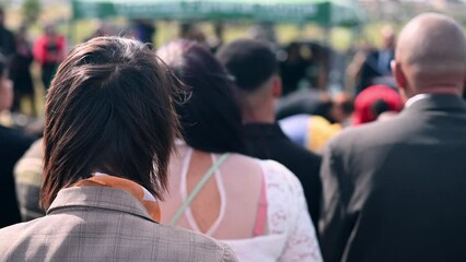 Rear view of people at funeral service