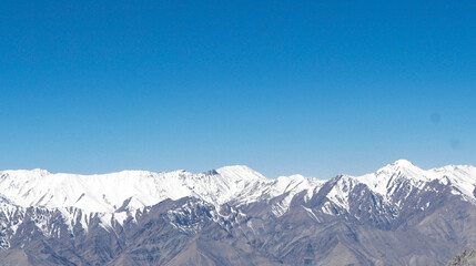 Fototapeta na wymiar Scenic high altitude mountain road at Ladakh India with view of the Himalayan mountain range.