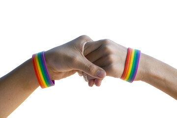 Isolated gay couple hands which wear rainbow wristband around on white background with clippping paths.