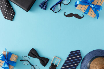 Trendy gift concept for Father's Day. Top view flat lay of gift boxes, paper mustache and male...