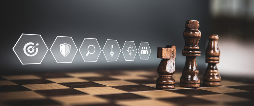 King chess pieces on teamwork with strategy icons concepts of leadership or wining challenge battle fighting of business team player and risk management or human resource or strategic planning.