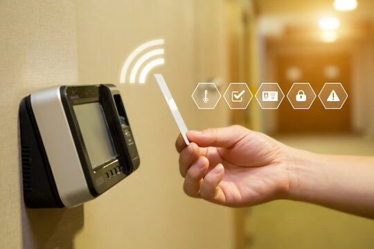 Proximity card reader door unlock, Hand security man using ID card on fingerprint scanning access control system for identity verification to open the door or for security safety or check attendance.