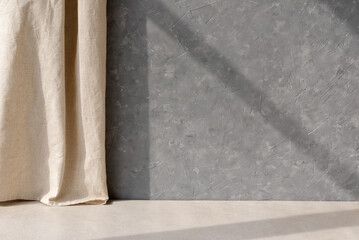 Empty gray concrete wall, beige stone floor, linen curtain, geometric sunlight shadow, blank home...