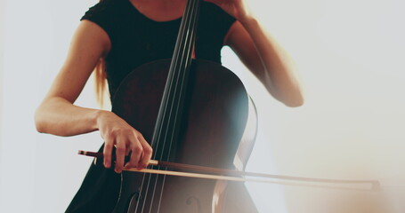 Single woman playing the cello, close-up and medium close-up, cello bow and strings, smooth...