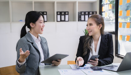 Business corporate team brainstorming, planning strategy having a discussion Analysis investment researching with chart at office desk documents in office.
