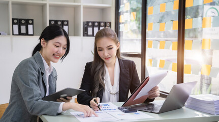 Business corporate team brainstorming, planning strategy having a discussion Analysis investment researching with chart at office desk documents in office.