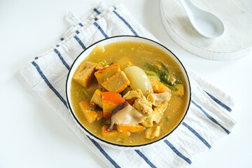stir fried yellow tofu, mushroom, chicken. chinese food