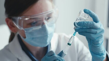 Vaccination as a vaccine administration process to prevent disease and maintain health. Typing a syringe close-up. The invention of new drugs in pharmacephthics and pharmacology. Scientific laboratory - Powered by Adobe