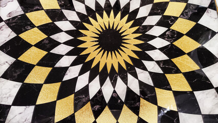 Circular stone mosaic rendering an hypnotic effect. Artistic pieces of stone or wood in handmade....