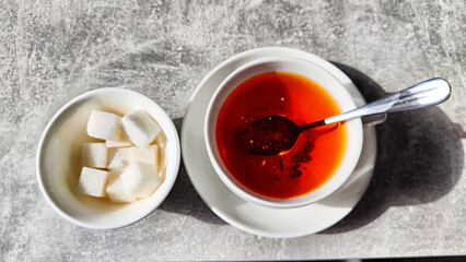 Black tea in a porcelain white cup on the table in vintage place. Tea ceremony