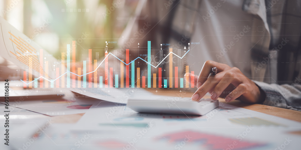 Poster accountant using a calculator to calculate numbers and reading graph report and business statistics charts ,Analysis and improvement of corporate strategy ,manage financial and marketing documents