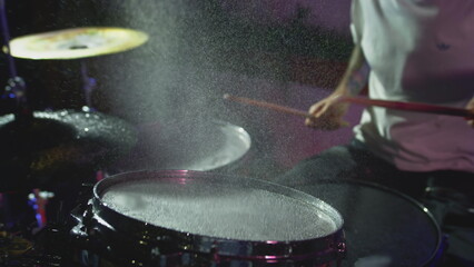 Super Slow Motion Shot of Drum Hit and Splashing Water at 1000 fps.