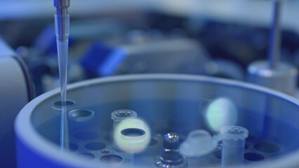 Apparatus for automatic sampling, analysis. A robo hand takes a sample from a test tube for testing or analysis. New technologies in science. Artificial intelligence is conducting an experiment