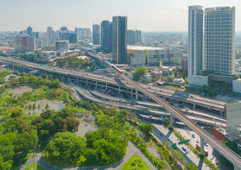 Aerial view of cars driving on Ladprao highway junction or moterway. Overpass bridge street roads in connection network of architecture concept. Top view. Urban city, Bangkok, Thailand.