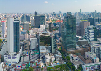 Aerial view of Bangkok Downtown Skyline, Thailand. Financial district and business centers in smart urban city in Asia. Skyscraper and high-rise buildings at sunset.