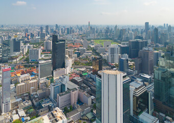 Fototapeta premium Aerial view of Bangkok Downtown Skyline, Thailand. Financial district and business centers in smart urban city in Asia. Skyscraper and high-rise buildings at sunset.