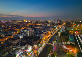Aerial view of Bangkok Downtown skyline, highway roads or street in Thailand. Financial district and business area in smart urban city. Skyscraper and high-rise buildings at night.