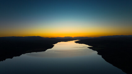 sunset over the lake. The setting sun over the lake as the evening sun sets. wonderful sky