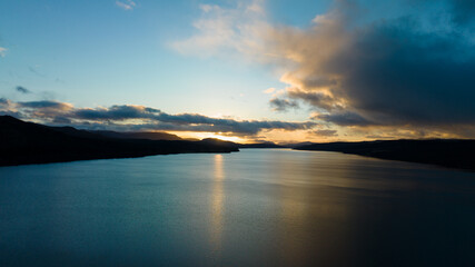 sunset over the lake. The setting sun over the lake as the evening sun sets. wonderful sky