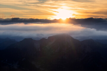 sunset over mountain peaks