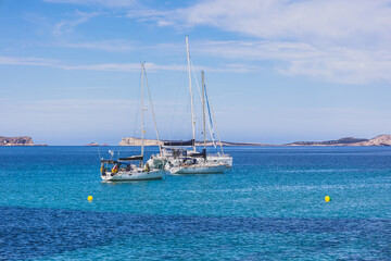 Ibiza beaches with beautiful turquoise waters. Beach at Sant Antoni de Portmany - Ibiza
