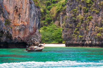 Pier or jetty on phi phi leh island in krabi in thailand near maya bay with boats and tourists on a...