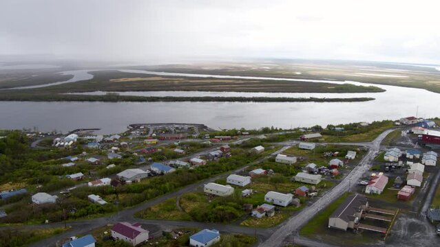 Aerial Shot Of Coastal Houses Near Sea Against Sky, Drone Flying Forward Over Human Settlement - Bering Sea, Alaska