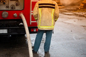 The work of firefighters on fire. Fighting fire in case of a building fire.