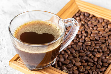 Cup and coffee beans on rustic background, coffee from Colombia