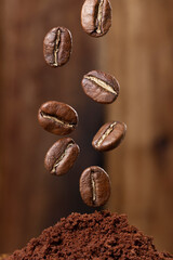 Roasted coffee beans from Colombia suspended in the air, Arabica variety.