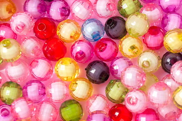 plastic beads for creativity background. Kid's DIY Craft. Colorful perler Children's Necklace Beads. Close-up, macro, finishing of fashionable clothes. make a beaded necklace.