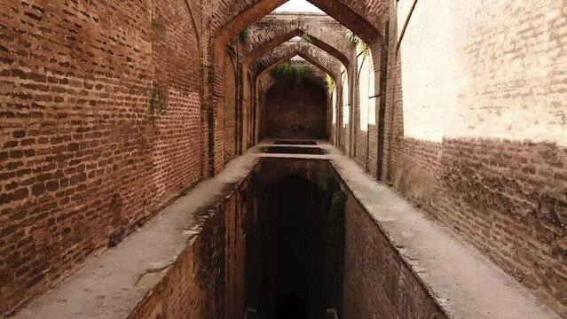 Experience the captivating allure of an ancient aqueduct in Punjab through a breathtaking drone pullout shot
