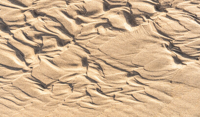 Sand beach texture background in summer, Sandy surface with rough wave ripple water well free space for text 