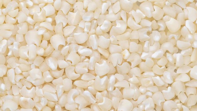 Closeup, top view of dried white corn or canjica. Food backdrop