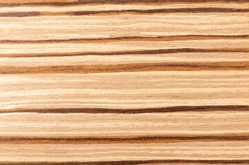 Natural wood background. Light olive wood veneer with contrasting brown stripes