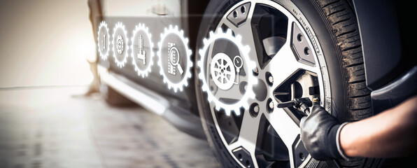 Auto mechanic use wrench to repairing and change car tires. Concept of car care service and...