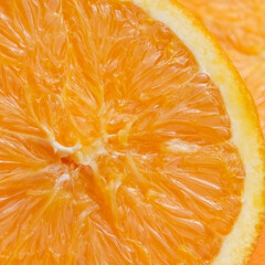 Juicy fresh orange in a cut close-up.