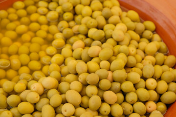 Green olives close-up on the market.