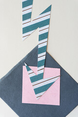 striped scrapbook machine-cut paper arrow on pink and gray paper