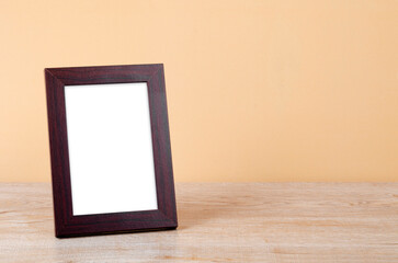The Vertical wooden frame Standing on the table. Save clipping path.