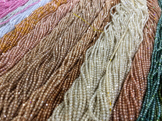 white and brown strands of glass beads