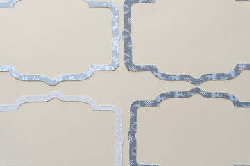 set of decorative tag or label borders with a holiday flavour or theme machine cut from scrapbook card stock paper