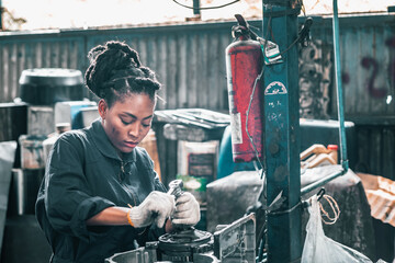 Auto mechanic diagnose and troubleshoots with tools and equipment. Polishing car, fixing braking and steering systems. Measuring oil levels with oil gauge stick and then pouring or changing it.