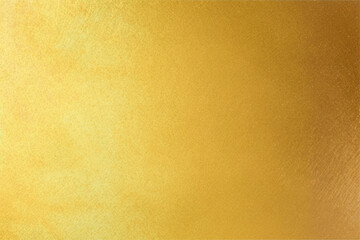 Shiny gold foil polished background with the reflection of golden light.